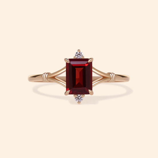 Dainty gold ring with emerald-cut garnet and sparkling moissanite accents