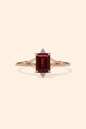 Dainty gold ring with emerald-cut garnet and sparkling moissanite accents