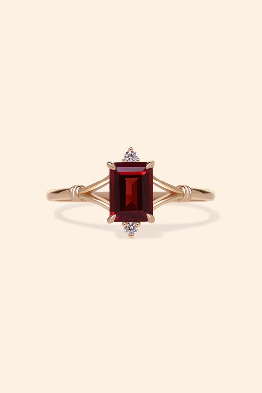 Dainty gold ring with emerald-cut garnet and sparkling moissanite accents