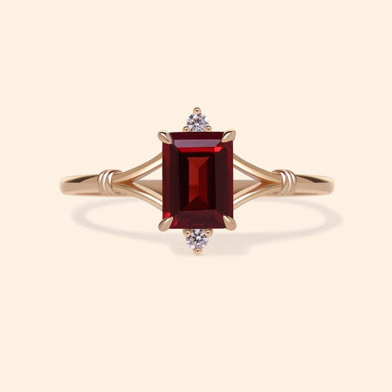 Dainty gold ring with emerald-cut garnet and sparkling moissanite accents