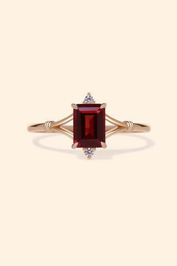 Dainty gold ring with emerald-cut garnet and sparkling moissanite accents