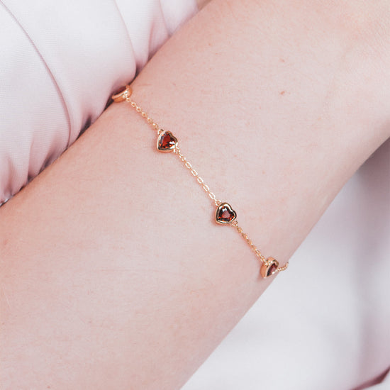 Dainty gold heart station bracelet with red heart-shaped stones