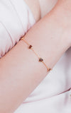 Dainty gold heart station bracelet with red heart-shaped stones