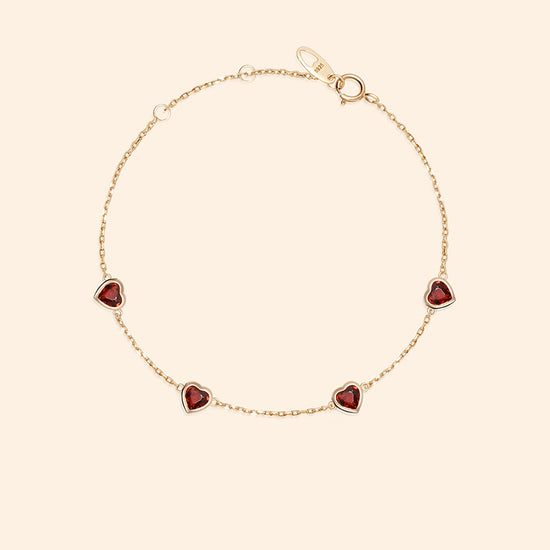 Dainty gold heart station bracelet with red heart-shaped stones