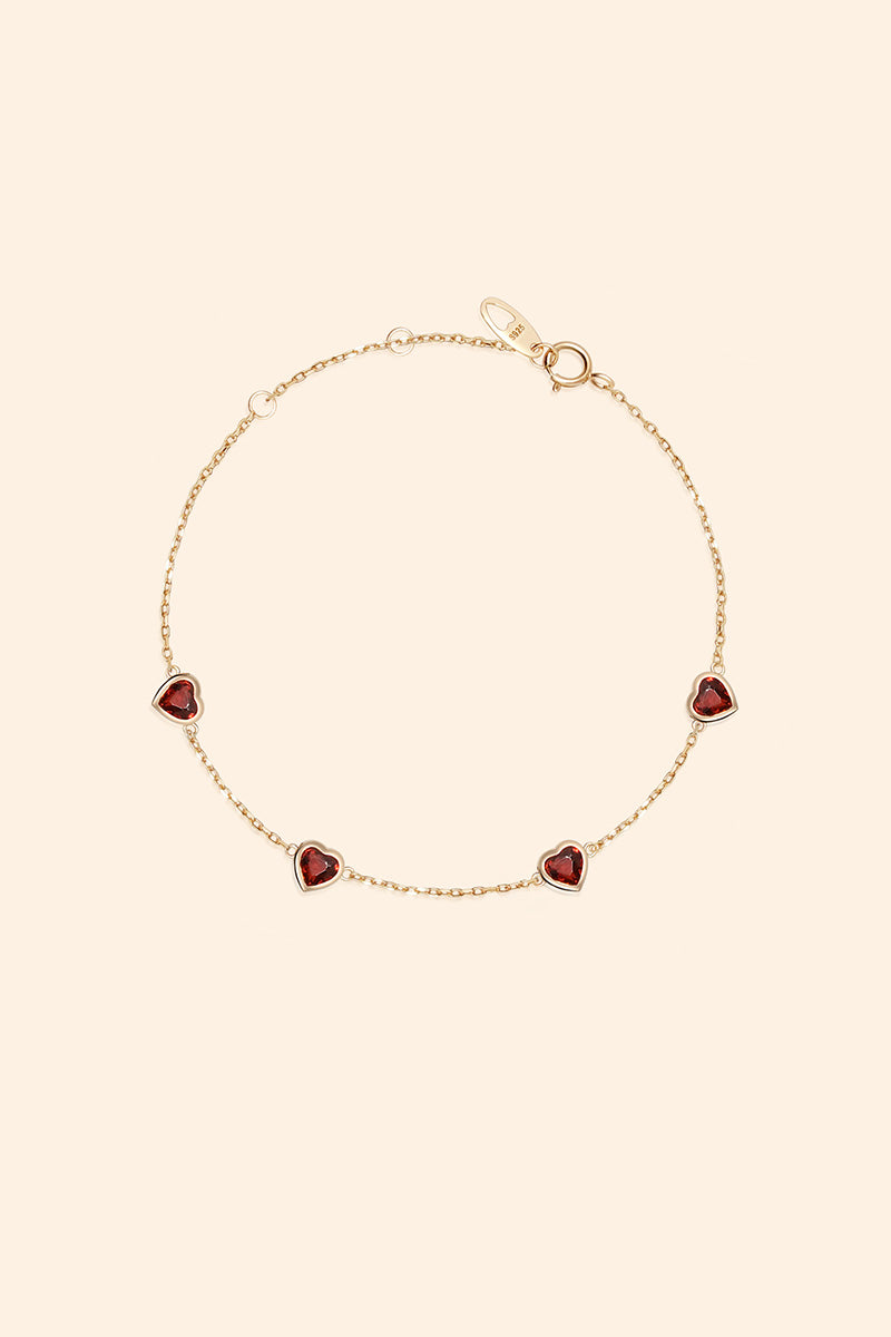 Dainty gold heart station bracelet with red heart-shaped stones