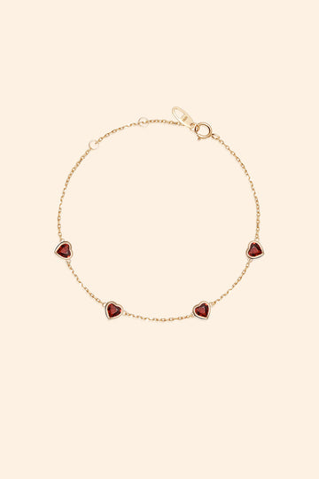 Dainty gold heart station bracelet with red heart-shaped stones