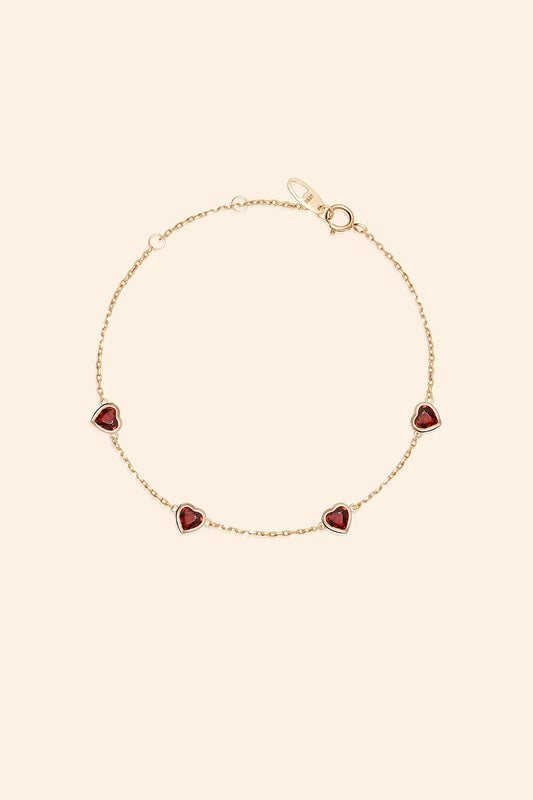 Dainty gold heart station bracelet with red heart-shaped stones