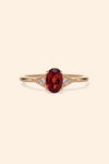 LIRAE vintage-style gold ring featuring an oval red garnet center stone and geometric rhombus accents with milgrain detailing, Art Deco stacking jewelry.