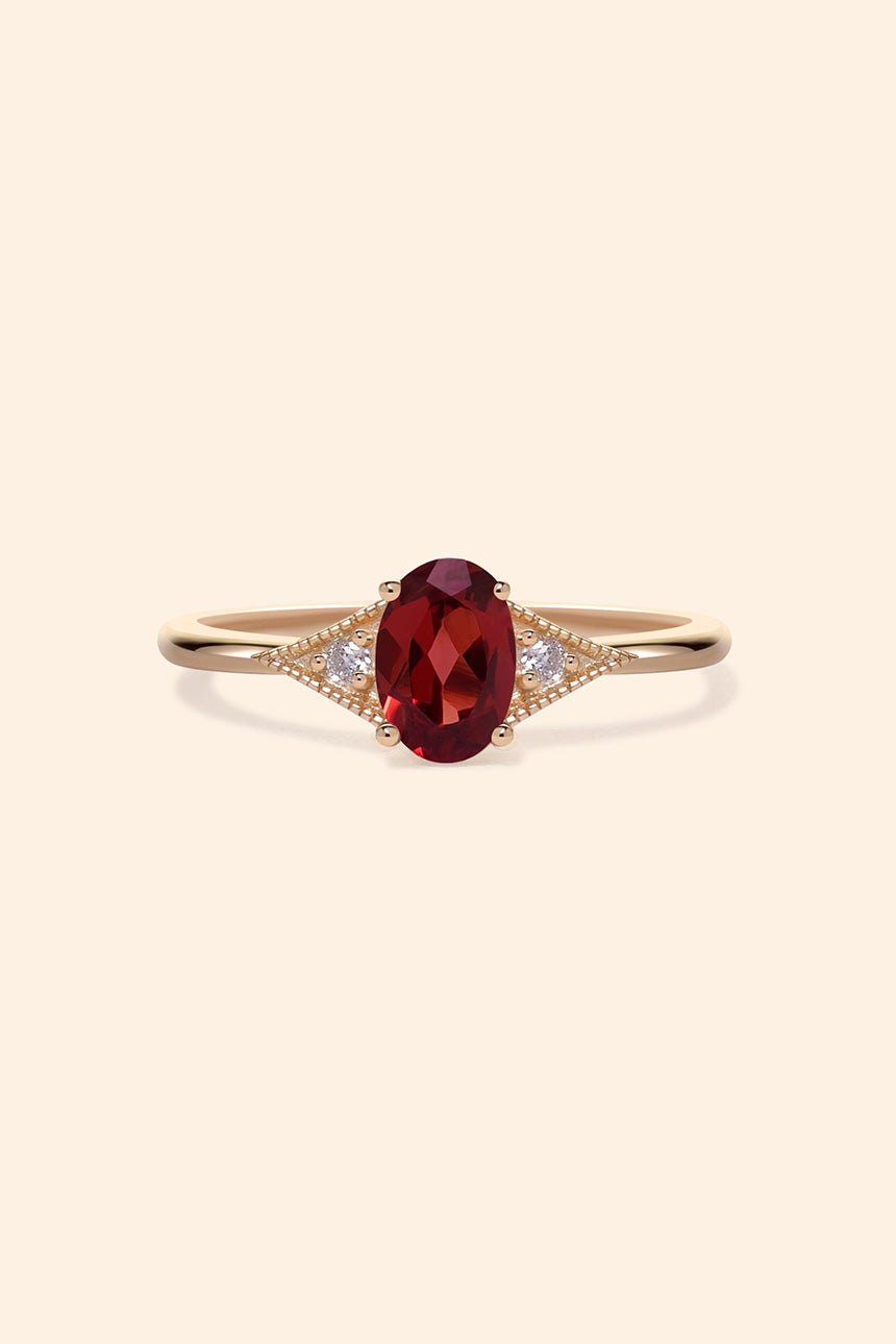 LIRAE vintage-style gold ring featuring an oval red garnet center stone and geometric rhombus accents with milgrain detailing, Art Deco stacking jewelry.