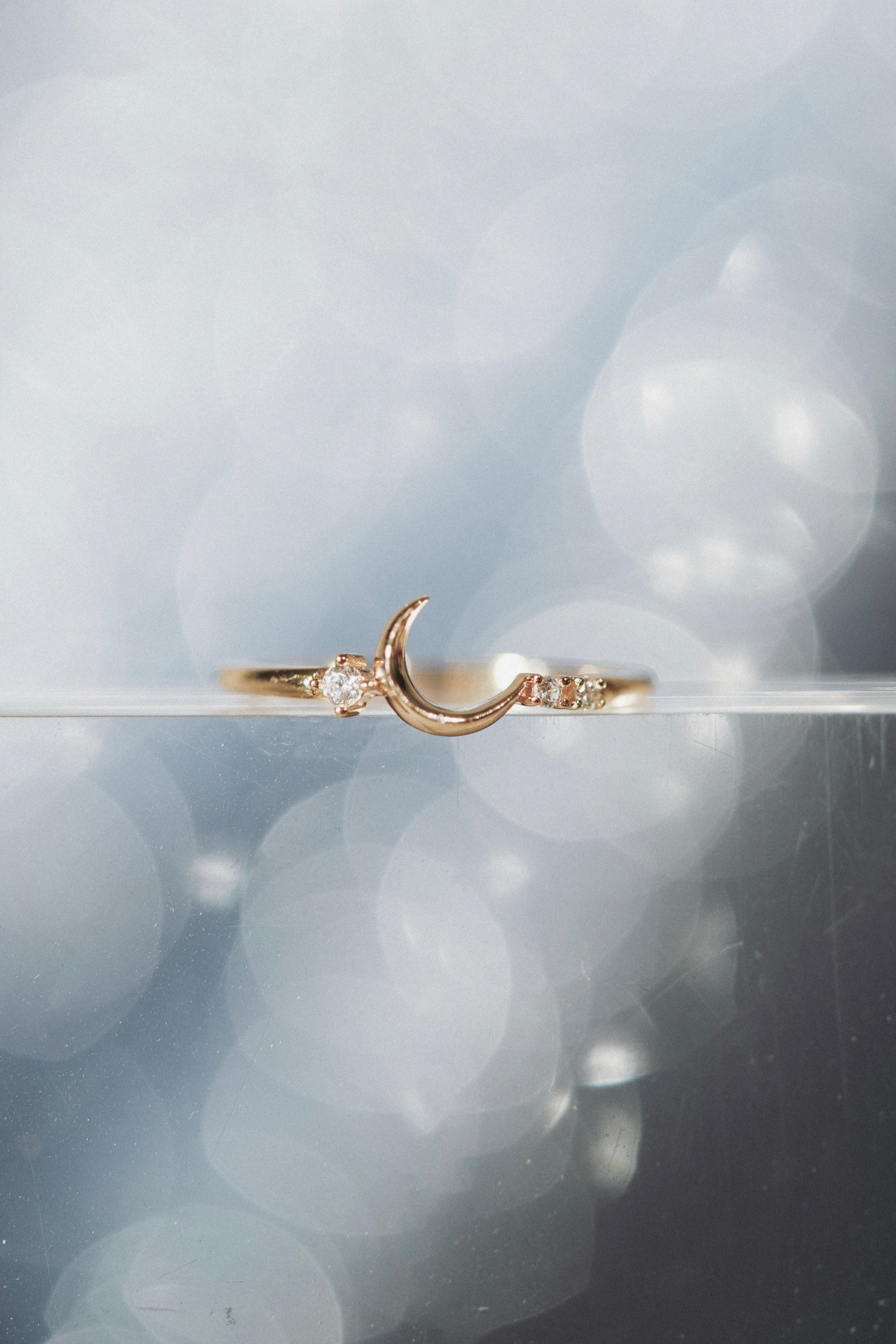 Minimalist crescent moon gold ring with asymmetric diamond accents, 14k gold vermeil 925 silver celestial talisman by LIRAE.