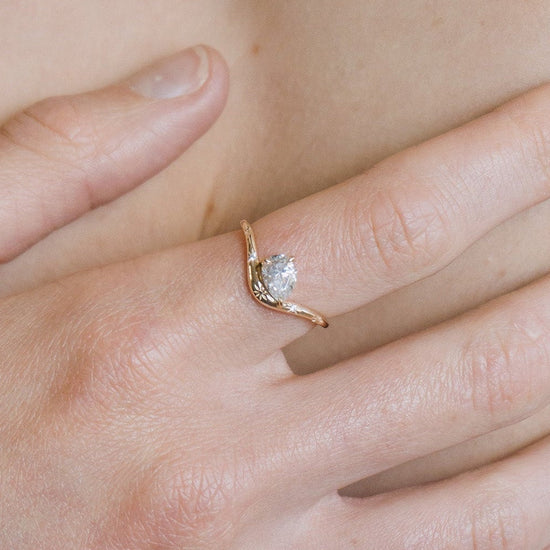 Gold vermeil pear cut diamond ring with engraved star details.
