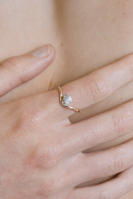 Gold vermeil pear cut diamond ring with engraved star details.