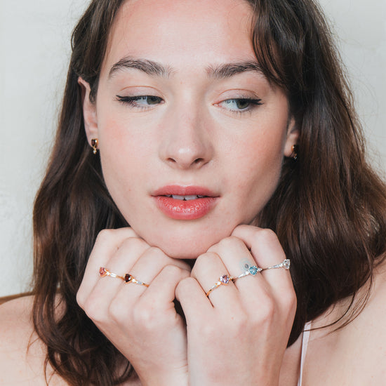 Heart-shaped red garnet ring in gold color with baguette diamond accents, vintage-inspired heirloom jewelry gift for her by LIRAE.