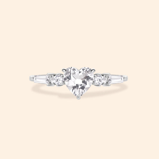 Heart-shaped clear quartz ring in silver color with baguette diamond accents, vintage-inspired heirloom jewelry gift for her by LIRAE.