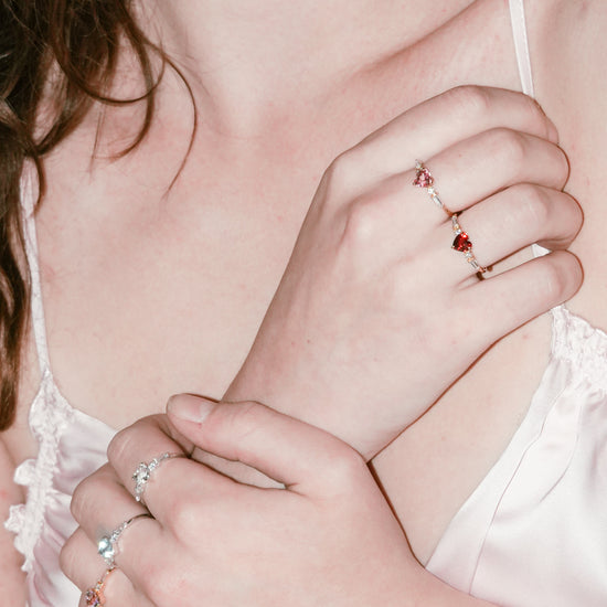 Heart-shaped red garnet ring in 14k gold color with baguette diamond accents, vintage-inspired heirloom jewelry gift for her by LIRAE.