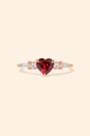 Heart-shaped red garnet ring in 14k gold color with baguette diamond accents, vintage-inspired heirloom jewelry gift for her by LIRAE.