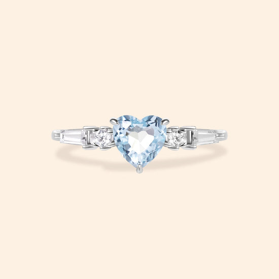 Heart-shaped sky blue topaz ring in silver with baguette diamond accents, vintage-inspired heirloom jewelry gift for her by LIRAE.