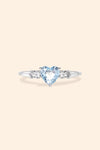 Heart-shaped sky blue topaz ring in silver with baguette diamond accents, vintage-inspired heirloom jewelry gift for her by LIRAE.