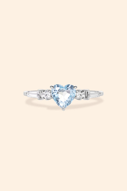 Heart-shaped sky blue topaz ring in silver with baguette diamond accents, vintage-inspired heirloom jewelry gift for her by LIRAE.