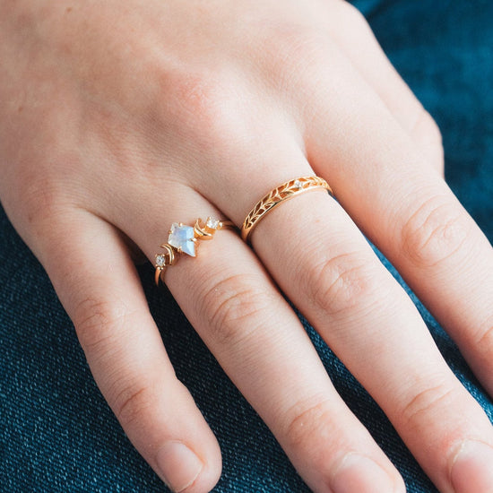 LIRAE celestial ring featuring a kite cut labradorite center stone and gold crescent moons, witchy aesthetic galaxy jewelry for women.