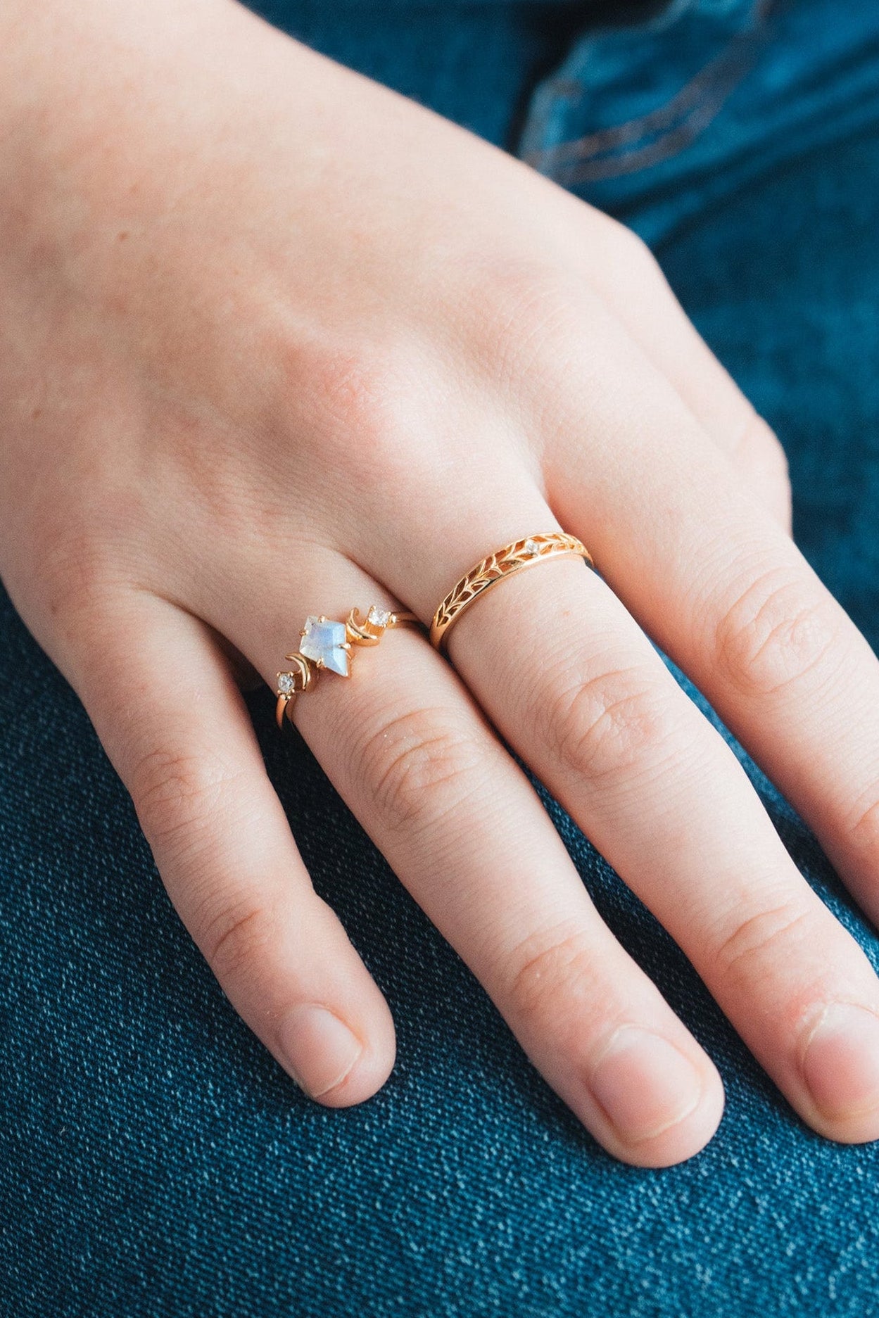 LIRAE celestial ring featuring a kite cut labradorite center stone and gold crescent moons, witchy aesthetic galaxy jewelry for women.