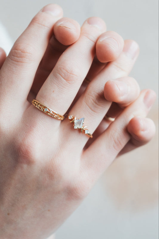 LIRAE celestial ring featuring a kite cut labradorite center stone and gold crescent moons, witchy aesthetic galaxy jewelry for women.