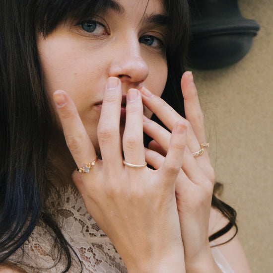 LIRAE celestial ring featuring a kite cut labradorite center stone and gold crescent moons, witchy aesthetic galaxy jewelry for women.