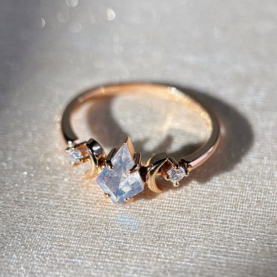LIRAE celestial ring featuring a kite cut labradorite center stone and gold crescent moons, witchy aesthetic galaxy jewelry for women.