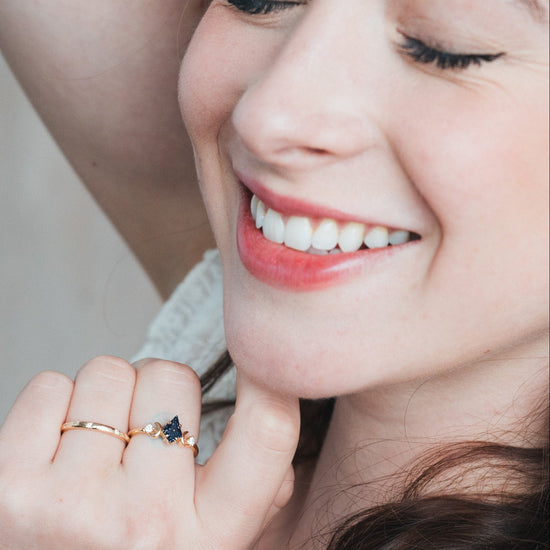 LIRAE celestial ring featuring a kite cut sandstone center stone and gold crescent moons, witchy aesthetic galaxy jewelry for women.