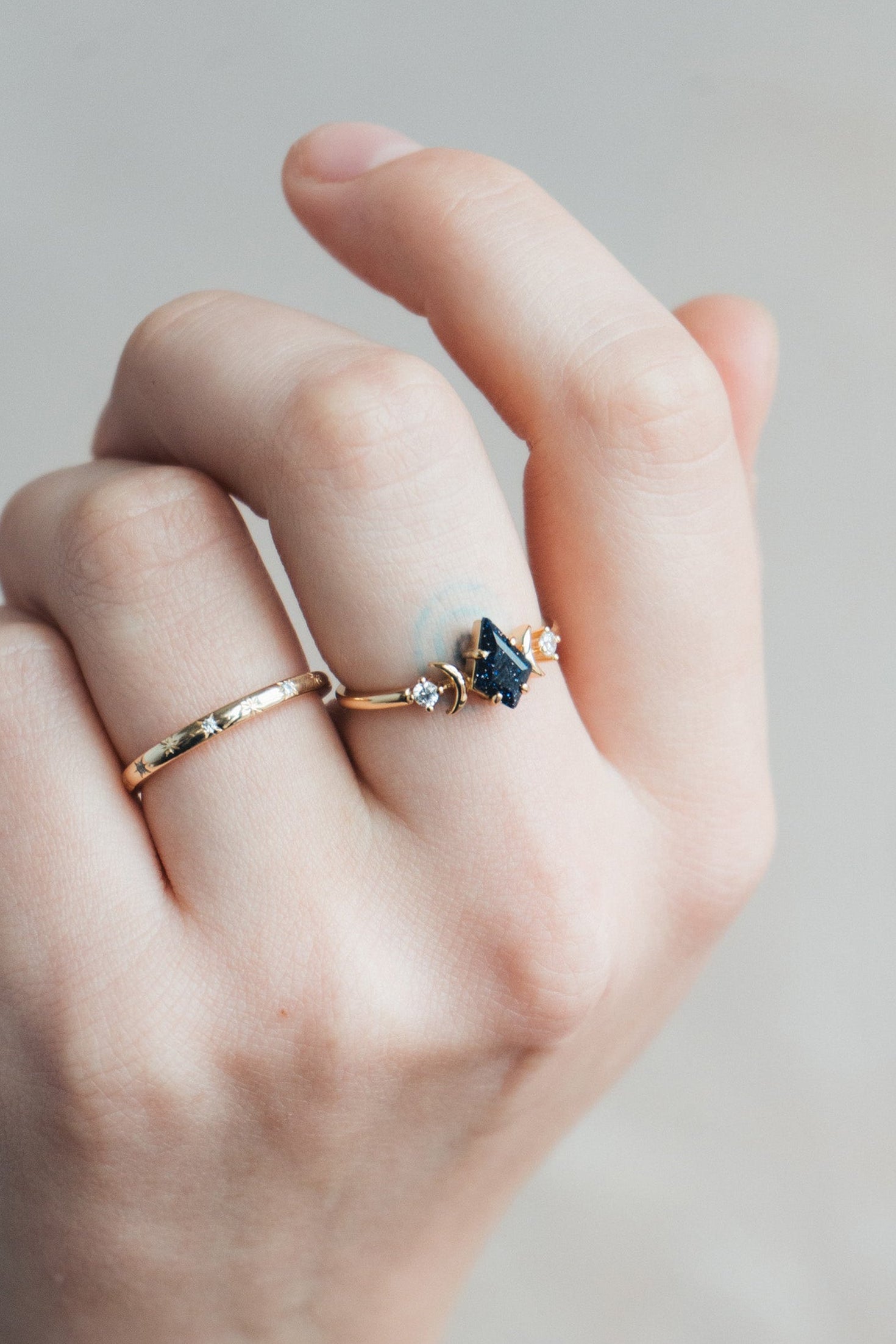 LIRAE celestial ring featuring a kite cut sandstone center stone and gold crescent moons, witchy aesthetic galaxy jewelry for women.