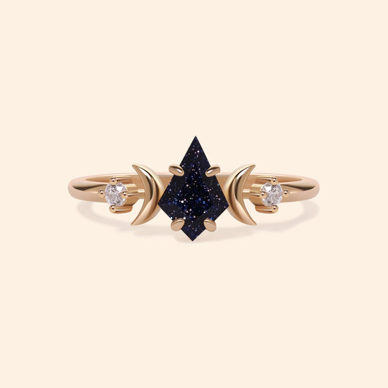 LIRAE celestial ring featuring a kite cut sandstone center stone and gold crescent moons, witchy aesthetic galaxy jewelry for women.