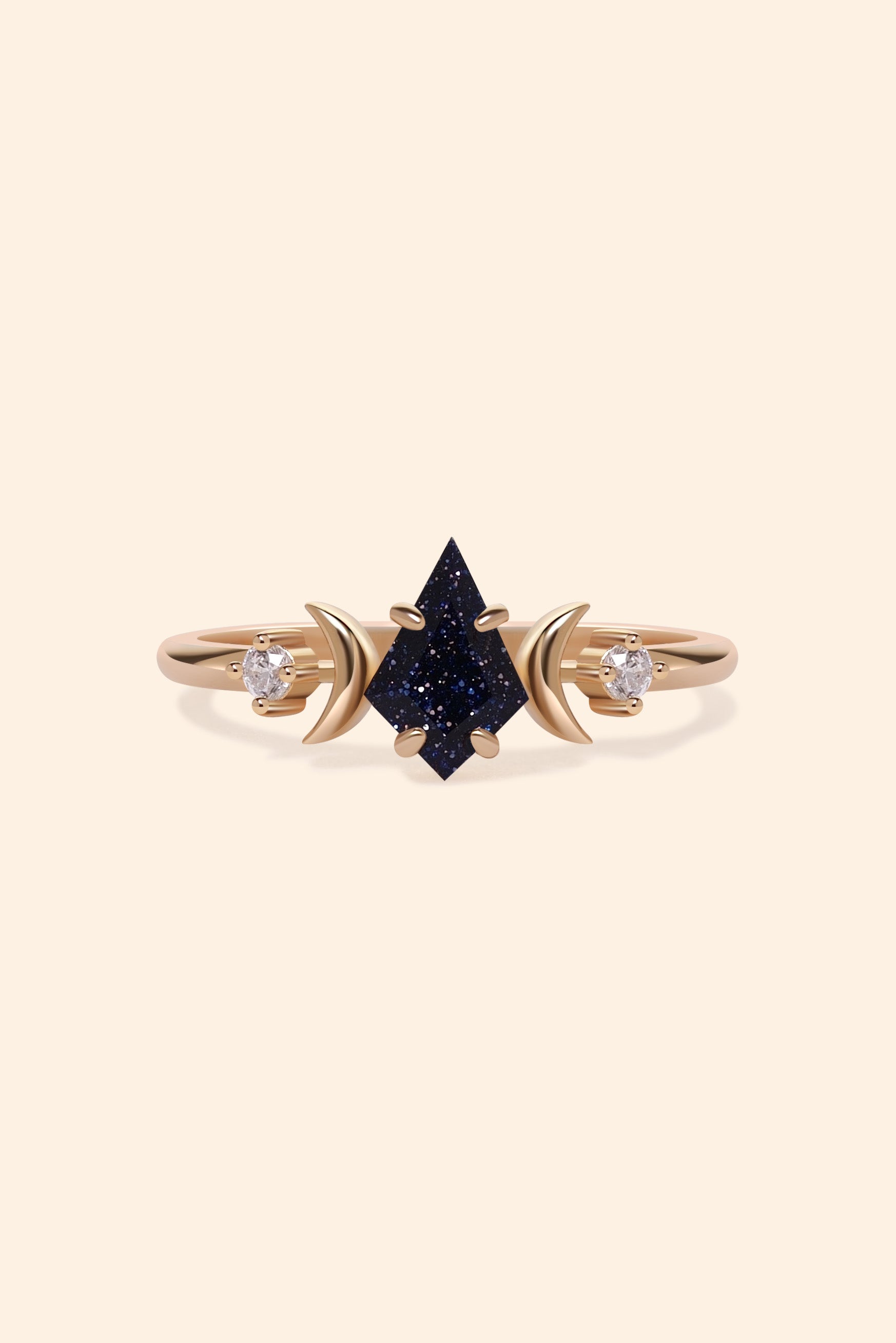 LIRAE celestial ring featuring a kite cut sandstone center stone and gold crescent moons, witchy aesthetic galaxy jewelry for women.