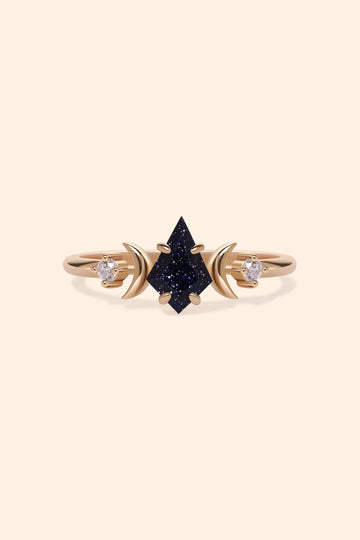 LIRAE celestial ring featuring a kite cut sandstone center stone and gold crescent moons, witchy aesthetic galaxy jewelry for women.
