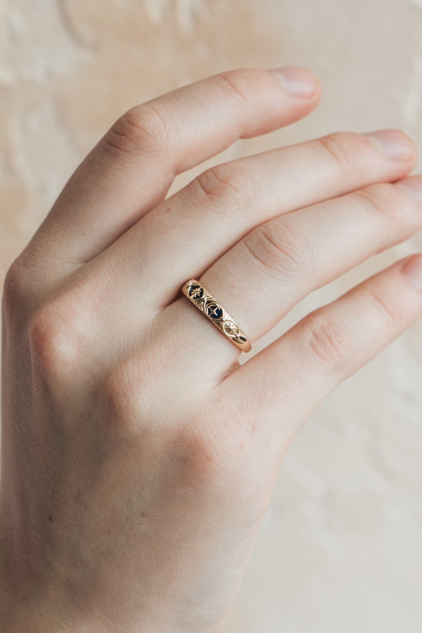Gold celestial star ring with deep blue lapis lazuli inlay and engraved sun moon details