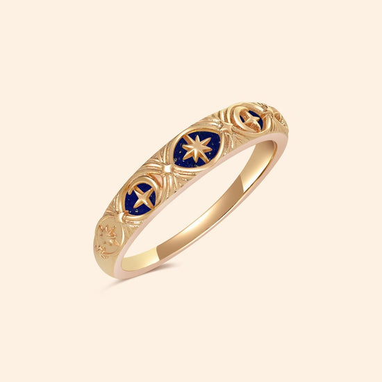 Gold celestial star ring with deep blue lapis lazuli inlay and engraved sun moon details