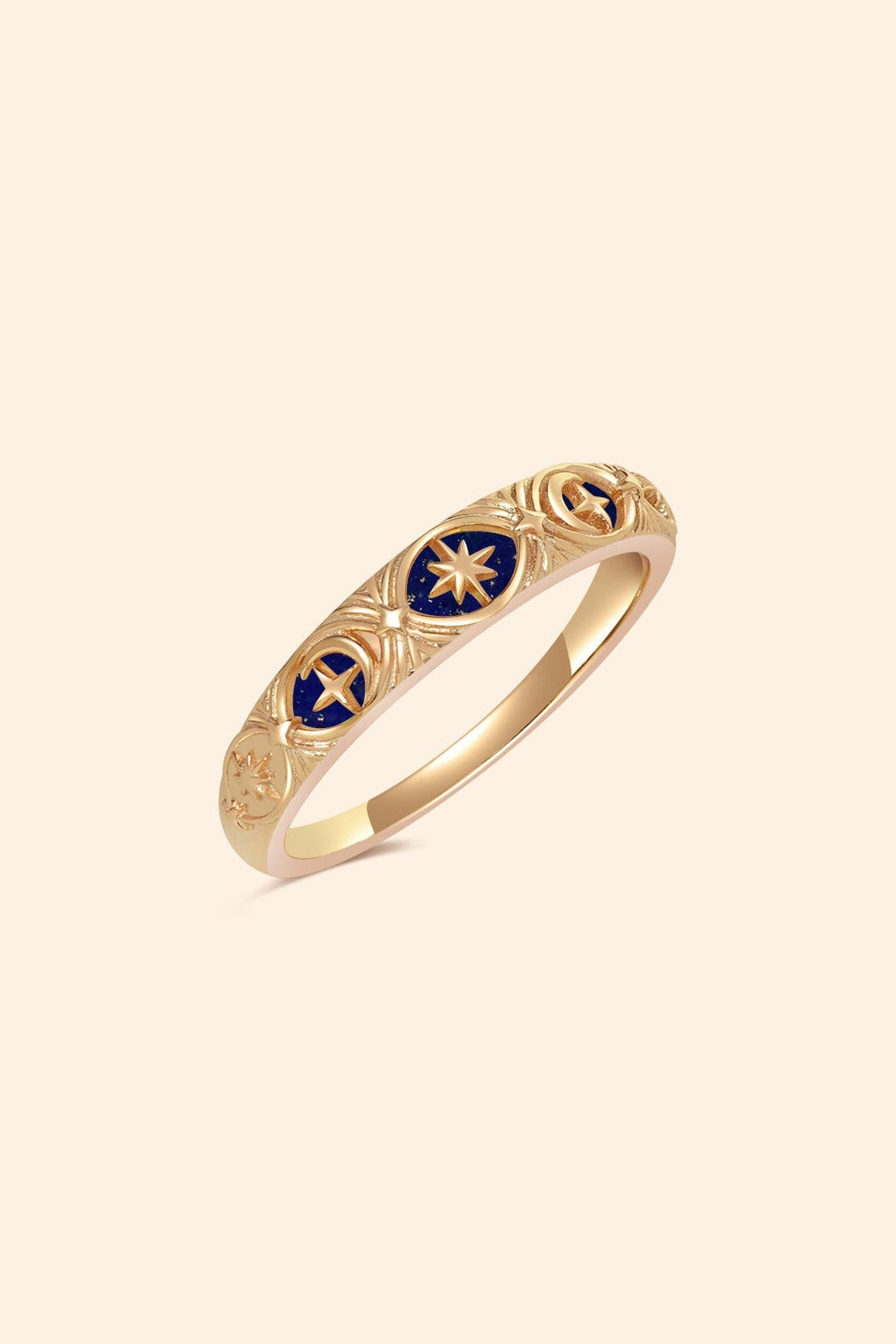 Gold celestial star ring with deep blue lapis lazuli inlay and engraved sun moon details