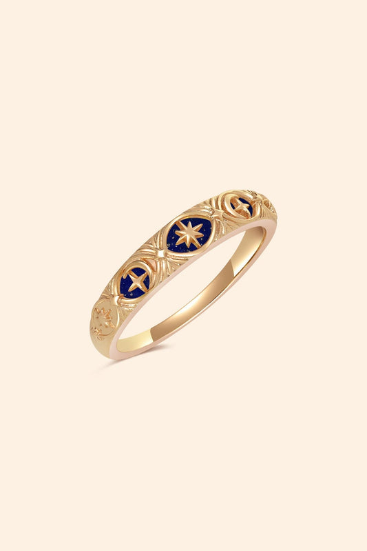 Gold celestial star ring with deep blue lapis lazuli inlay and engraved sun moon details
