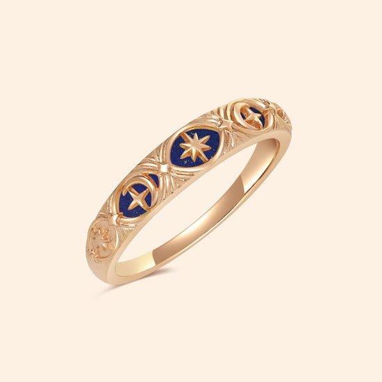 Gold celestial star ring with deep blue lapis lazuli inlay and engraved sun moon details