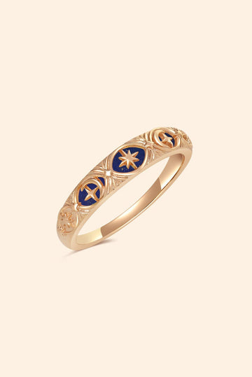 Gold celestial star ring with deep blue lapis lazuli inlay and engraved sun moon details