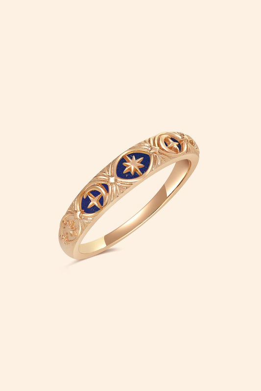 Gold celestial star ring with deep blue lapis lazuli inlay and engraved sun moon details