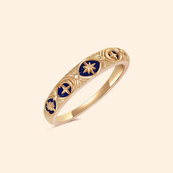Gold celestial star ring with deep blue lapis lazuli inlay and engraved sun moon details