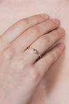 Dainty gold iolite eye ring with marquise purple-blue center stone and sparkling side stones