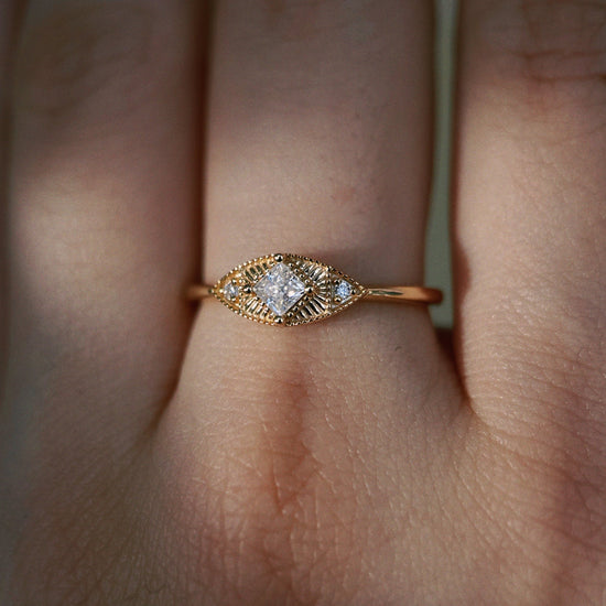 LIRAE vintage-inspired gold ring featuring a square-cut moissanite and sunburst radiant texture, geometric Art Deco jewelry for women.