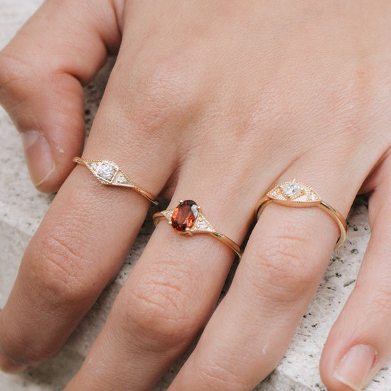 LIRAE Art Deco gold ring featuring a geometric rhombus design with milgrain edges and three moissanites, vintage-inspired stackable jewelry.