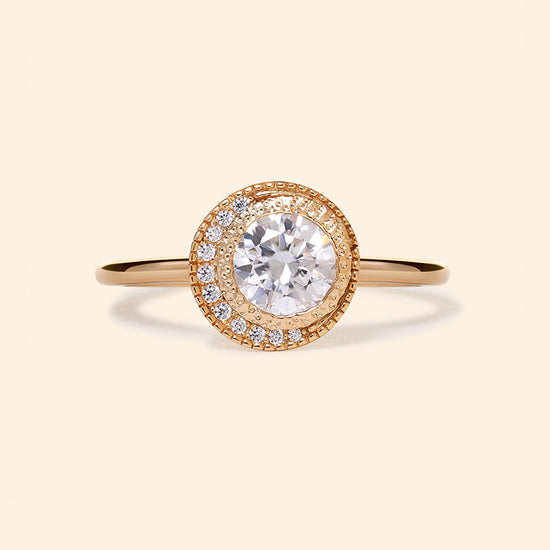 Gold halo ring with round center moissanite stone