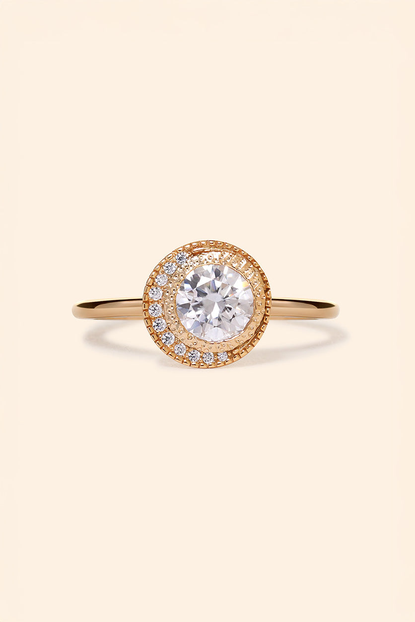 Gold halo ring with round center moissanite stone