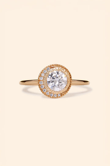 Gold halo ring with round center moissanite stone