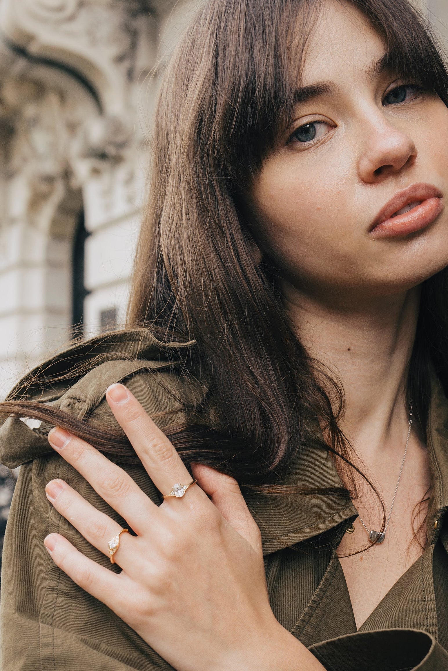 LIRAE vintage-style gold ring featuring an oval moissanite center stone and geometric rhombus accents with milgrain detailing, Art Deco stacking jewelry.