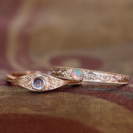 LIRAE moonstone ring featuring golden swirl filigree and an eye-shaped silhouette, ethereal vintage jewelry for women in gold.