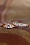 LIRAE moonstone ring featuring golden swirl filigree and an eye-shaped silhouette, ethereal vintage jewelry for women in gold.